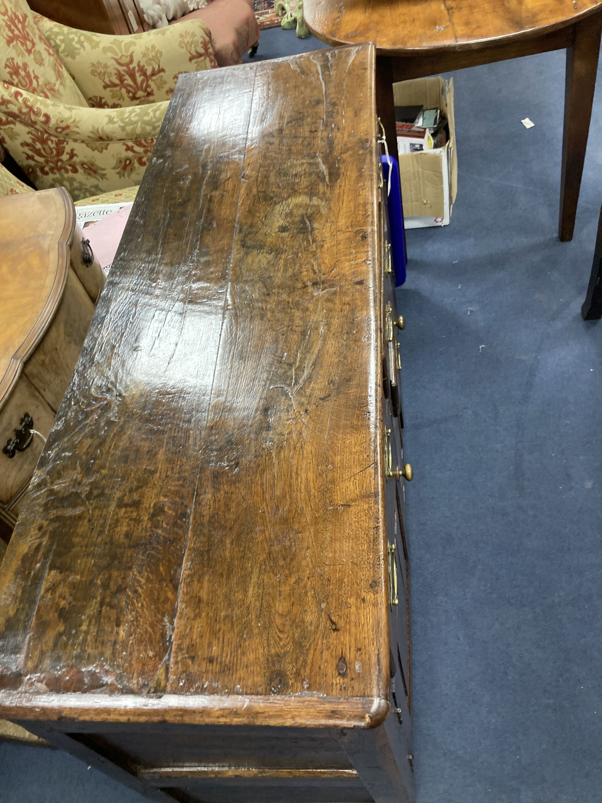 A mid 18th century oak dresser base, length 140cm, depth 46cm, height 86cm